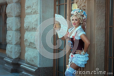 Girl in old clothes and vintage hair on his head. Stock Photo