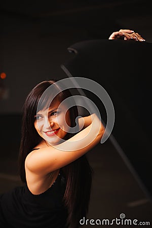 Girl opens the car hood Stock Photo