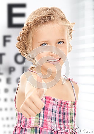 Girl with optical eye chart Stock Photo