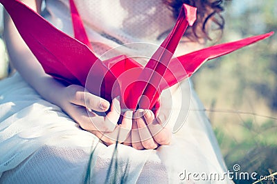 Girl with origami crane Stock Photo