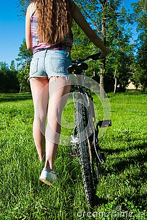 Girl outgoing with her bicycle Stock Photo