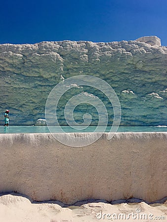 A girl paddles in a Blue pool at Pamukkale, Turkey Editorial Stock Photo