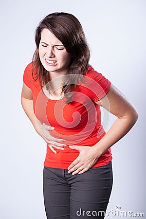 Girl with pain in the abdomen Stock Photo