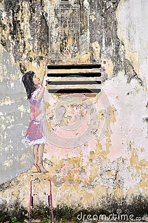 Girl painted by Ernest Zacharevic in Ipoh. Editorial Stock Photo