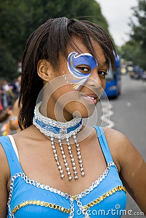 Girl with a painted face & a turquoise costume Editorial Stock Photo