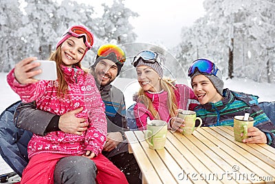 Girl with parents and brother making selfie at winter holiday Stock Photo