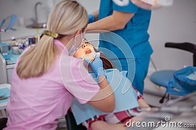 Girl patient at a reception at the dentist. Stock Photo