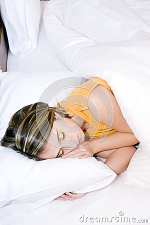 Girl peacefully sleeping in her bed Stock Photo