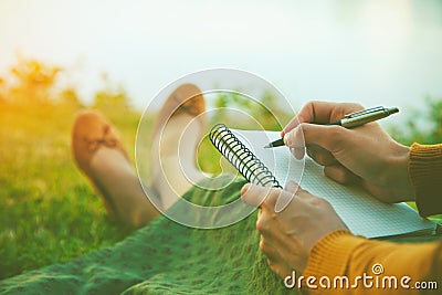 Girl with pen writing Stock Photo
