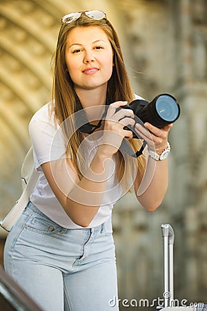 Girl photographing in city Stock Photo