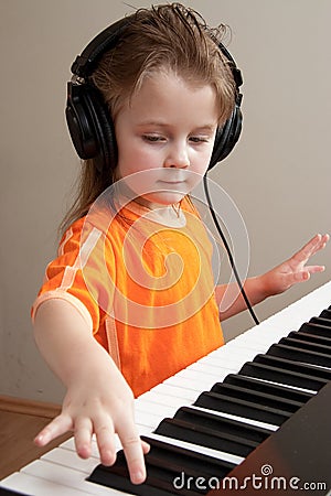 Girl at piano Stock Photo