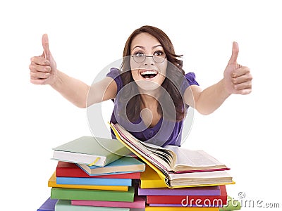 Girl with pile book showing thumb up. Stock Photo