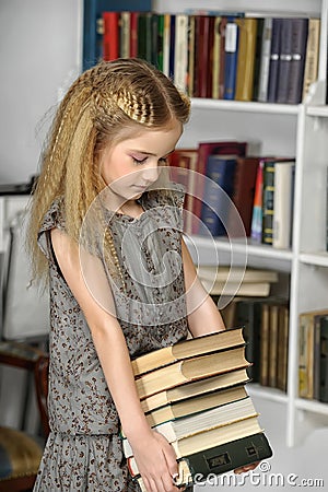 Girl with a pile of books Stock Photo