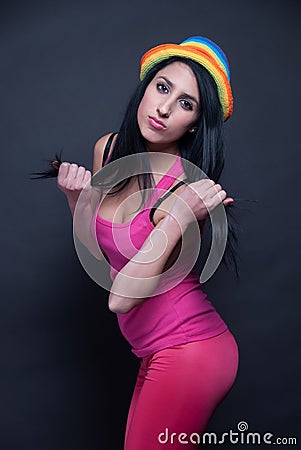 Girl in pink with colorful hat Stock Photo