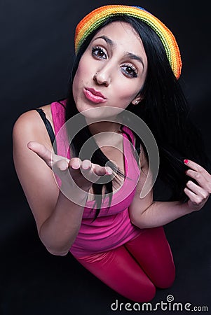 Girl in pink with colorful hat Stock Photo