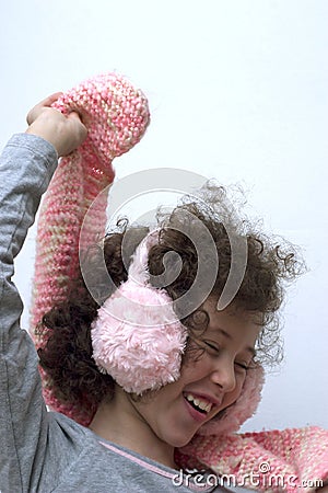 Girl with pink earmuff and pink scarf Stock Photo