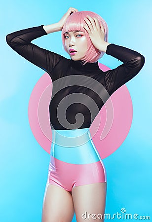 Girl with pink haircut in bodysuit Stock Photo