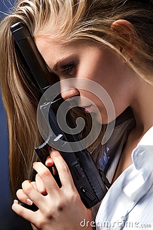 Girl with pistol Stock Photo