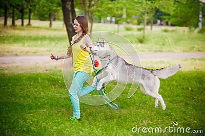 Girl play with husky dog Stock Photo