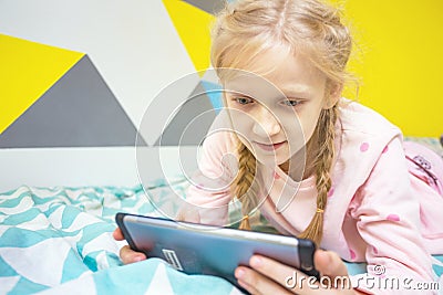 Girl play on the tablet Stock Photo