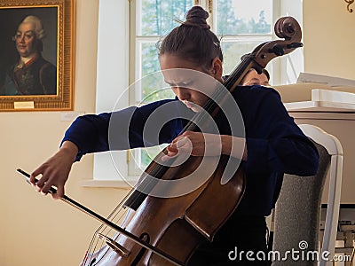 Girl playing the cello. Saint-Petersburg. Spring 2017 Editorial Stock Photo