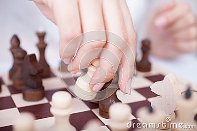 Girl playing chess Stock Photo