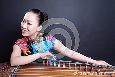 Girl playing Chinese zither Stock Photo