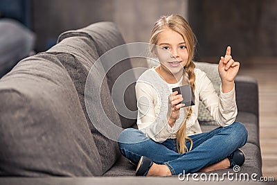 Girl playing with cube Stock Photo