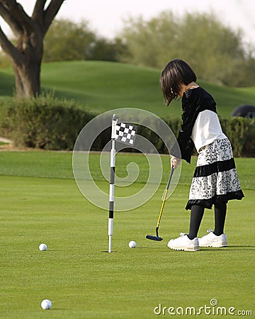 Girl Playing Golf Stock Photo