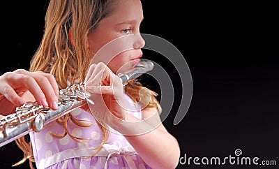 Girl Playing Instrument Stock Photo