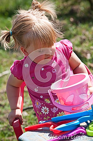 Girl playing outdoors Stock Photo