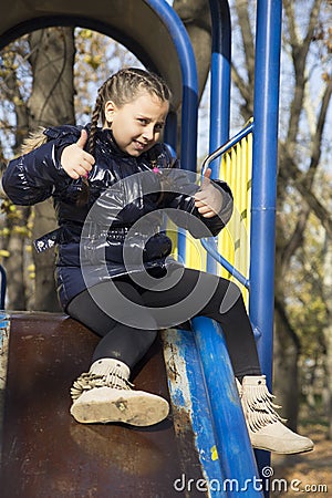 The girl playing on the playground Stock Photo