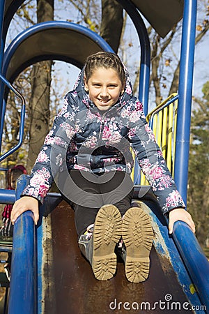 The girl playing on the playground Stock Photo