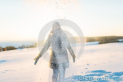 Girl playing in the snow Stock Photo