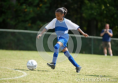 Girl playing soccer Stock Photo