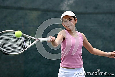 Girl playing tennis Stock Photo