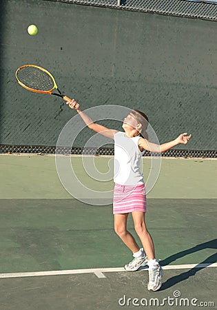 Girl playing tennis Stock Photo