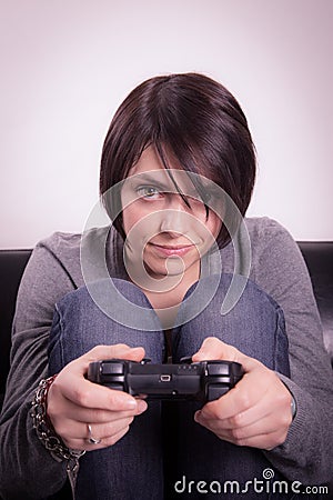 Girl playing video games Stock Photo