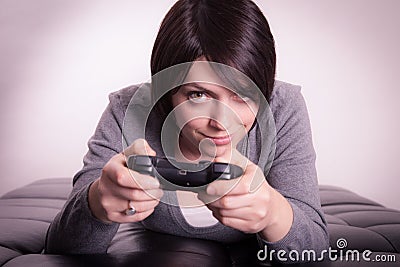 Girl playing video games Stock Photo