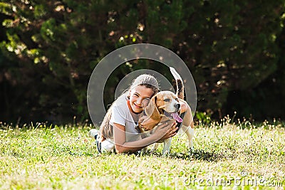 Girl plays with a dog Stock Photo