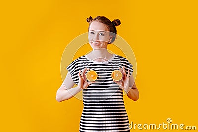 Girl portraying her breast with halves of oranges Stock Photo