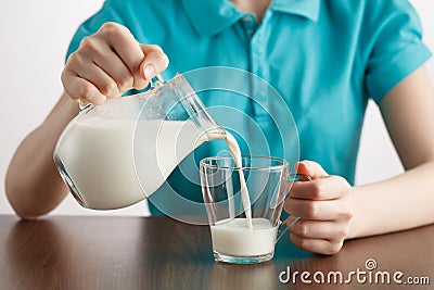 Girl pouring healthy lifestyle milk food Stock Photo