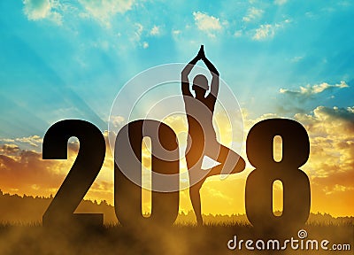 Girl practicing yoga in the New Year 2018. Stock Photo