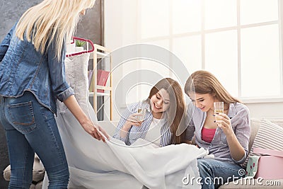 Girl preparing for wedding and showing wedding dress Stock Photo