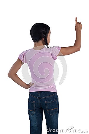 Girl pretending to touch an invisible screen against white background Stock Photo