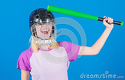 Girl pretty blonde wear baseball helmet and hold bat on blue background. Beat her head with bat. Dumb idea concept. Girl Stock Photo