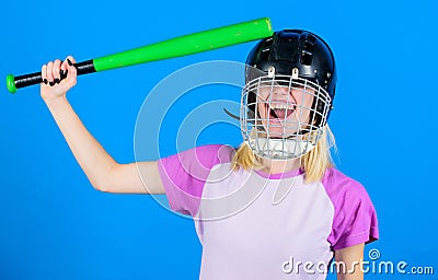 Girl pretty blonde wear baseball helmet and hold bat on blue background. Beat her head with bat. Dumb idea concept. Girl Stock Photo