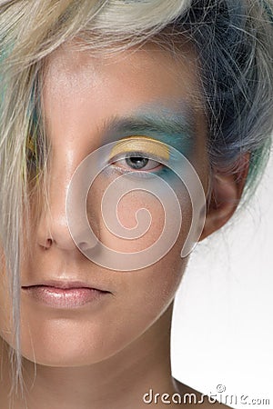 Girl with professional hair colouring and creative make up in peacock style Stock Photo