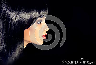 The girl in profile with black straight shiny hair. Stock Photo