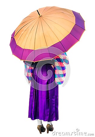 A girl in a purple dress standing under lilac umbrella. Back view of woman in kimono holding big umbrella isolated on Stock Photo